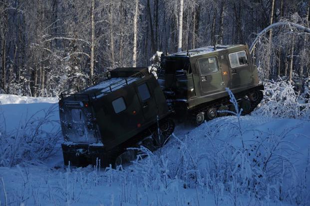 Soldier drives a small unit support vehicle.
