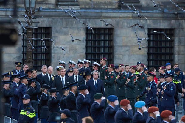 Dutch King Willem-Alexander and Queen Maxima arrive to lay a wreath during a solemn annual national service.